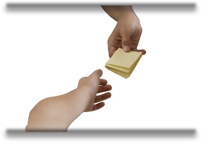 A hand passing a stack of notes to another hand